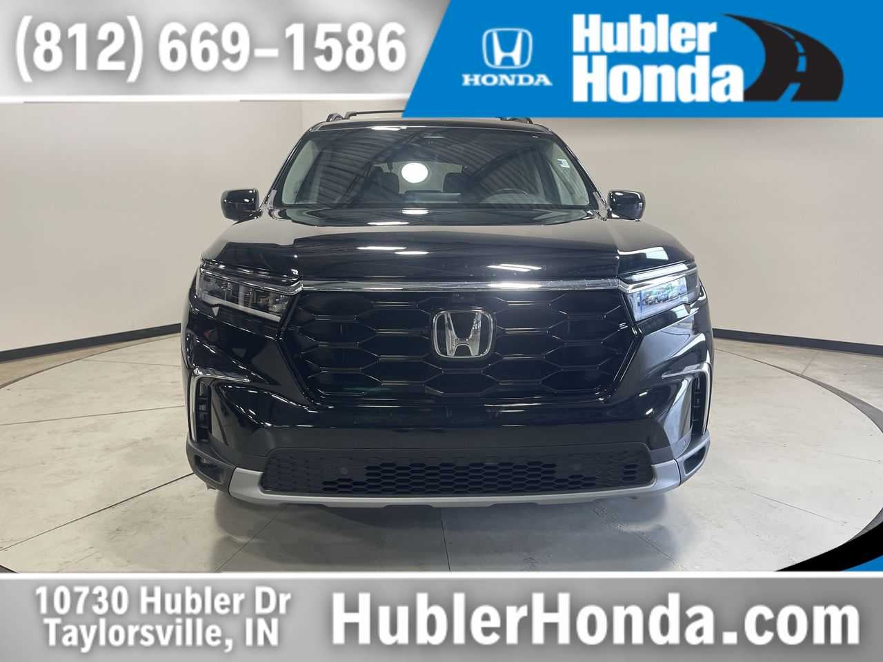 2025 Honda Pilot Elite in Crystal Black Pearl — front three-quarter view