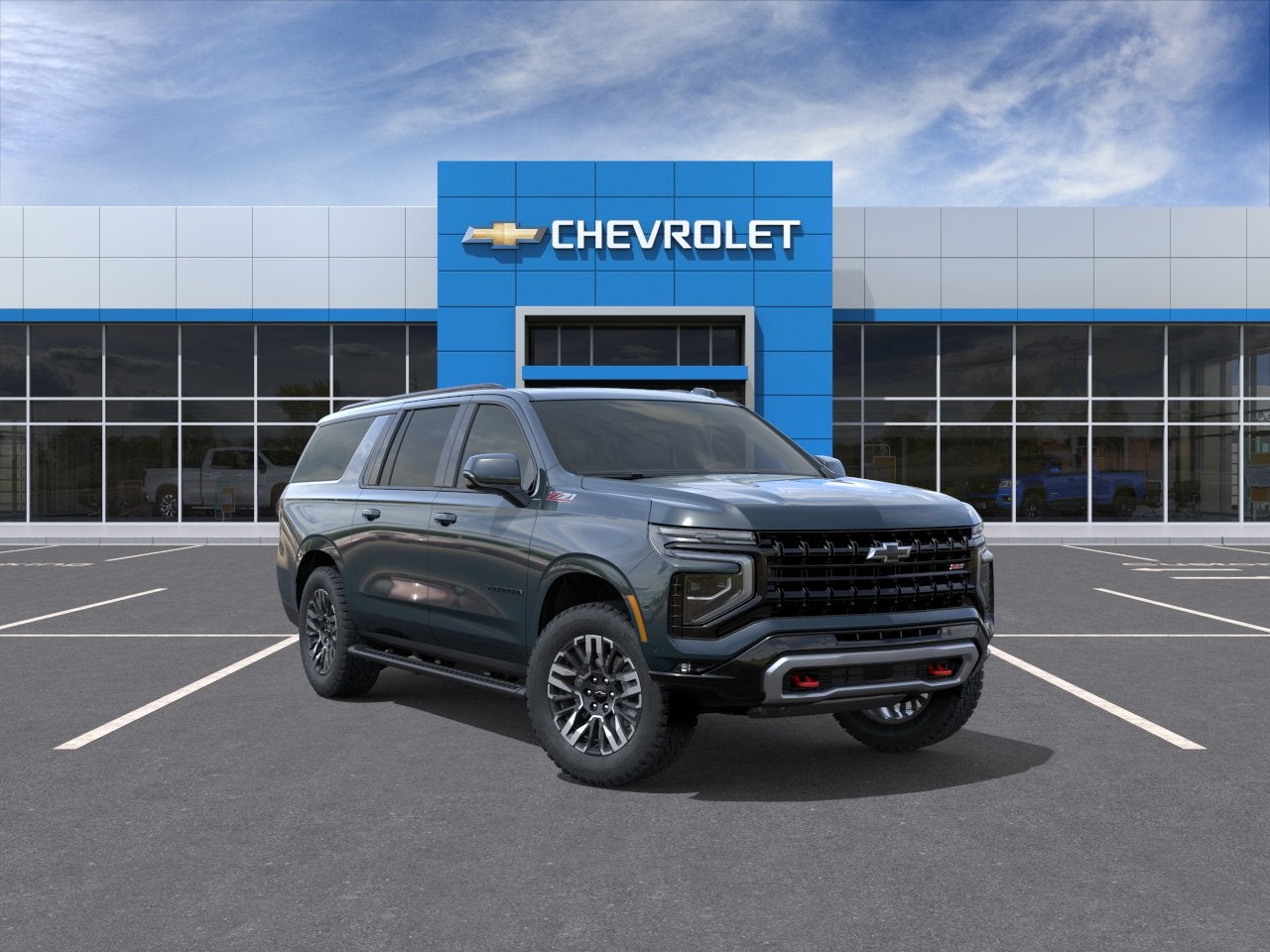 2026 Chevrolet Suburban Z71 in Cypress Gray — front three-quarter view