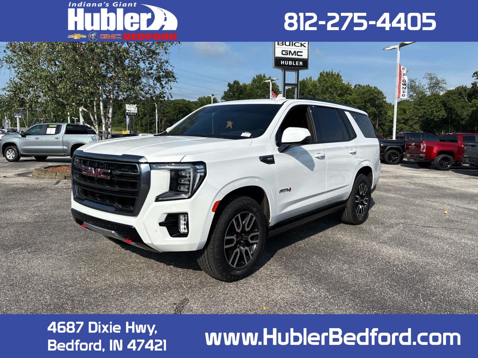 2024 GMC Yukon AT4 in Summit White — front three-quarter view