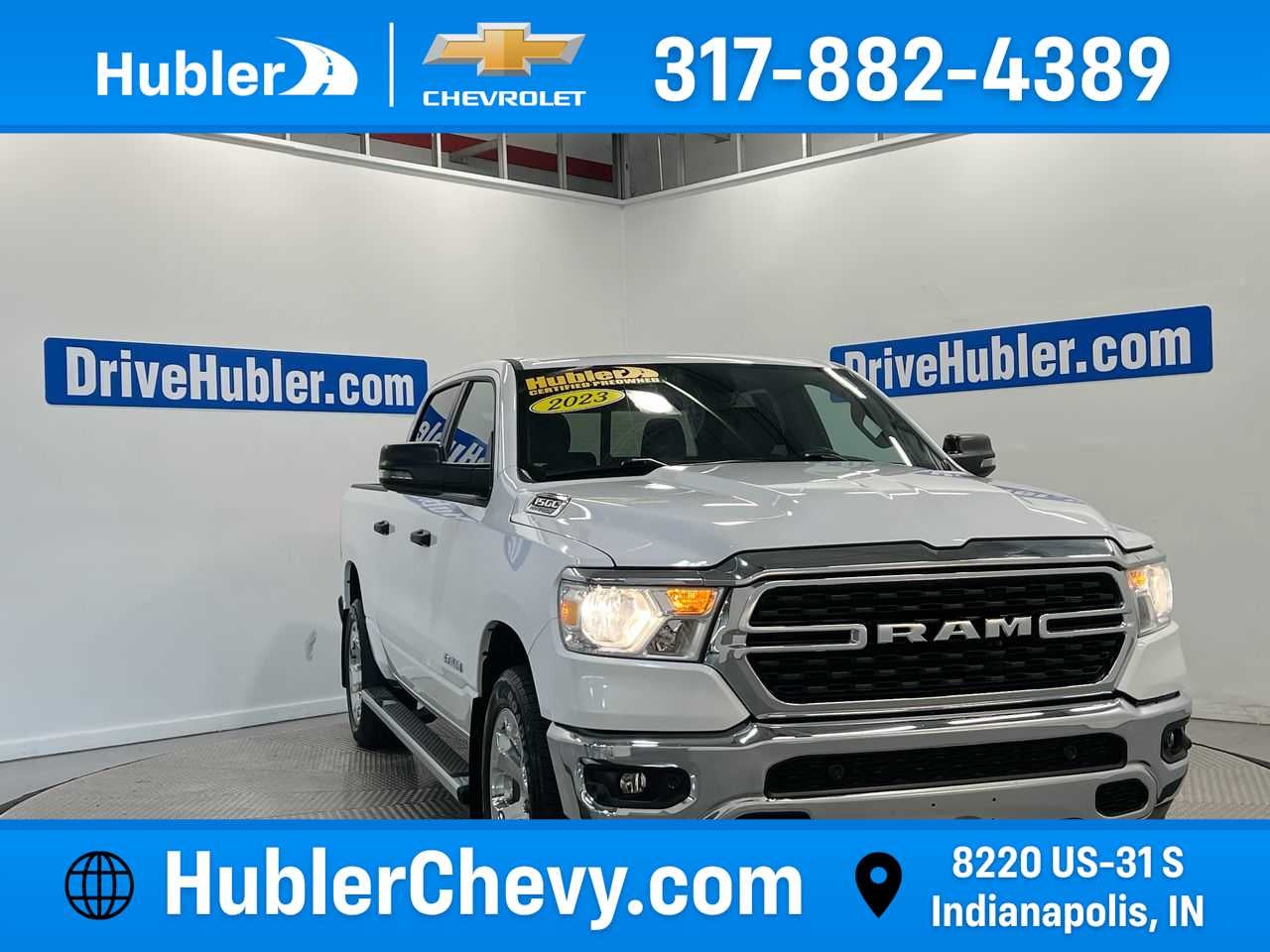 2023 RAM 1500 Big Horn in Platinum White Pearl — front three-quarter view
