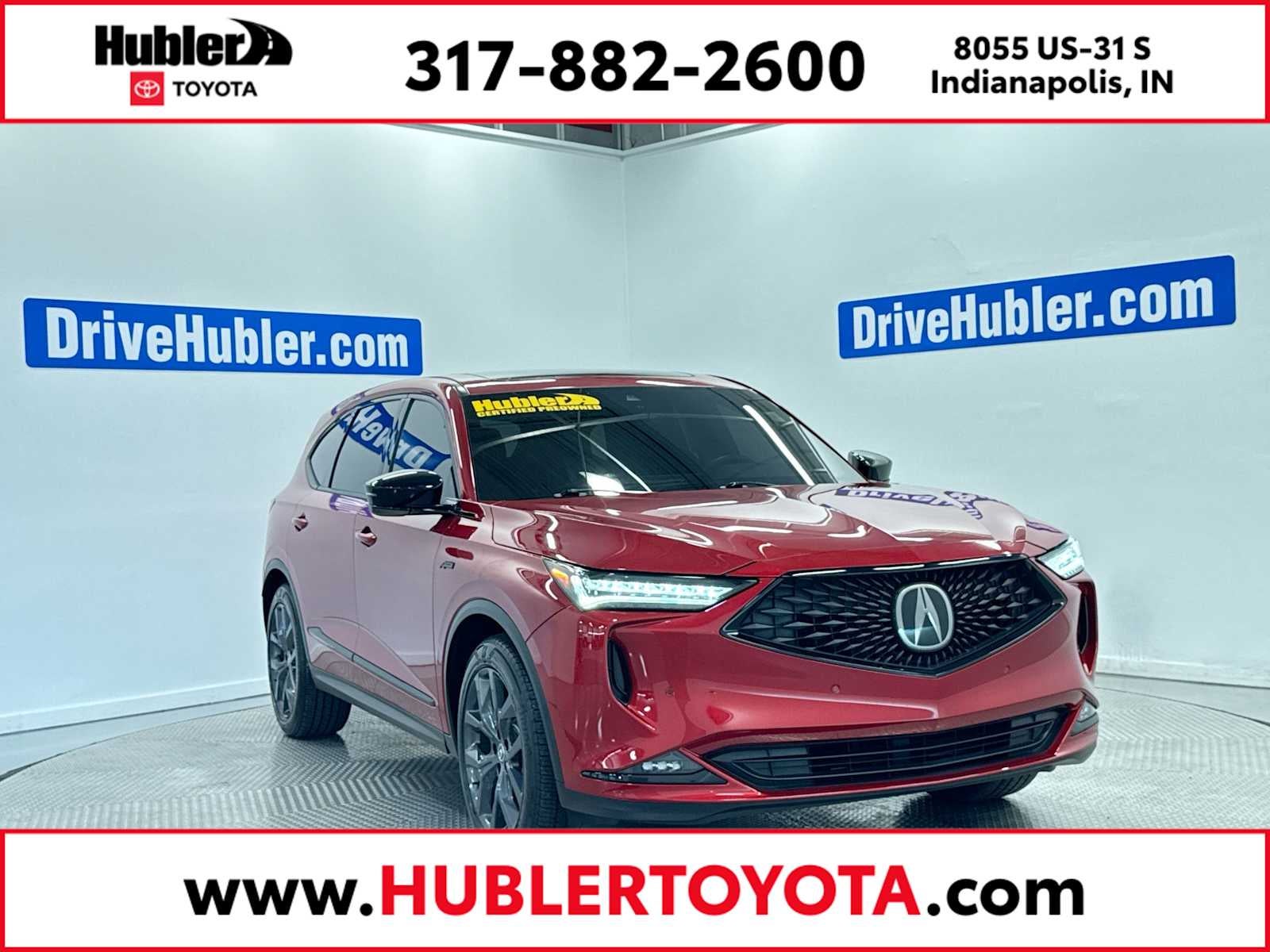 2023 Acura MDX w/A-Spec Package in Performance Red Pearl — front three-quarter view