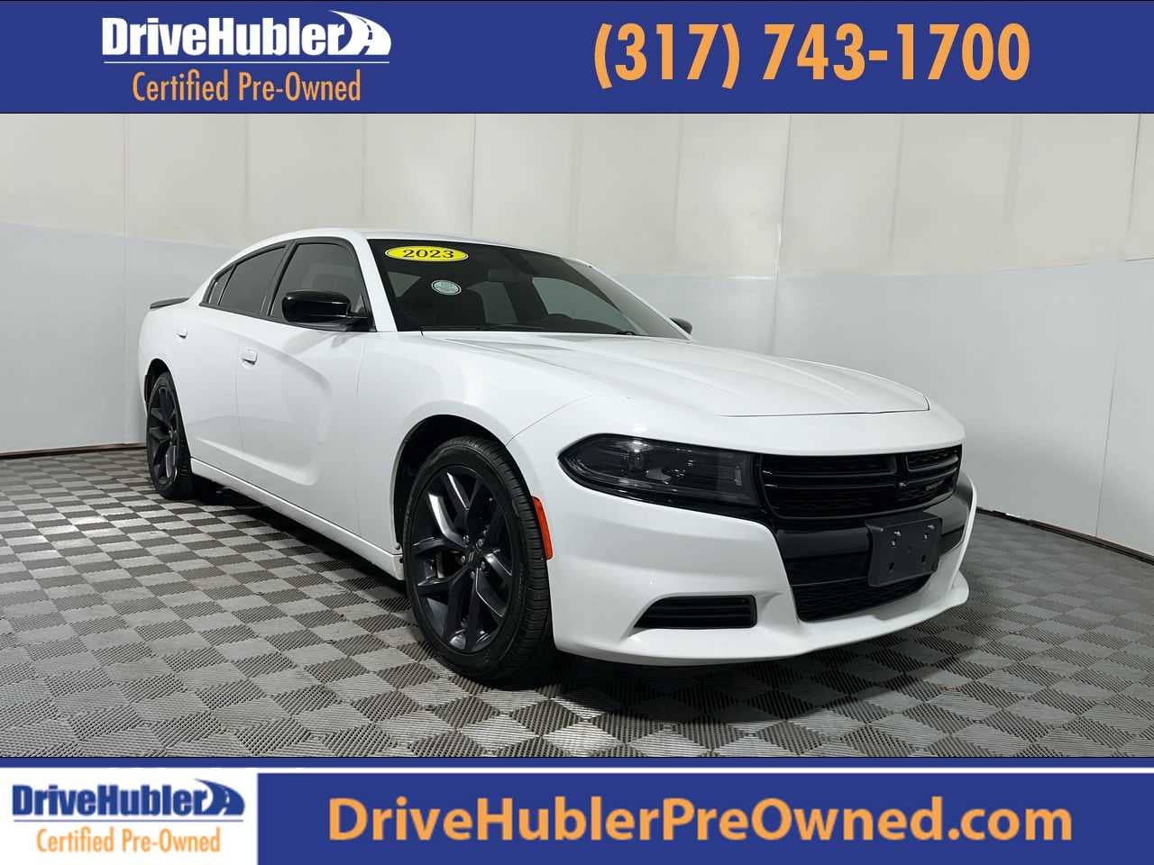 2023 Dodge Charger SXT in White Knuckle Clearcoat — front three-quarter view