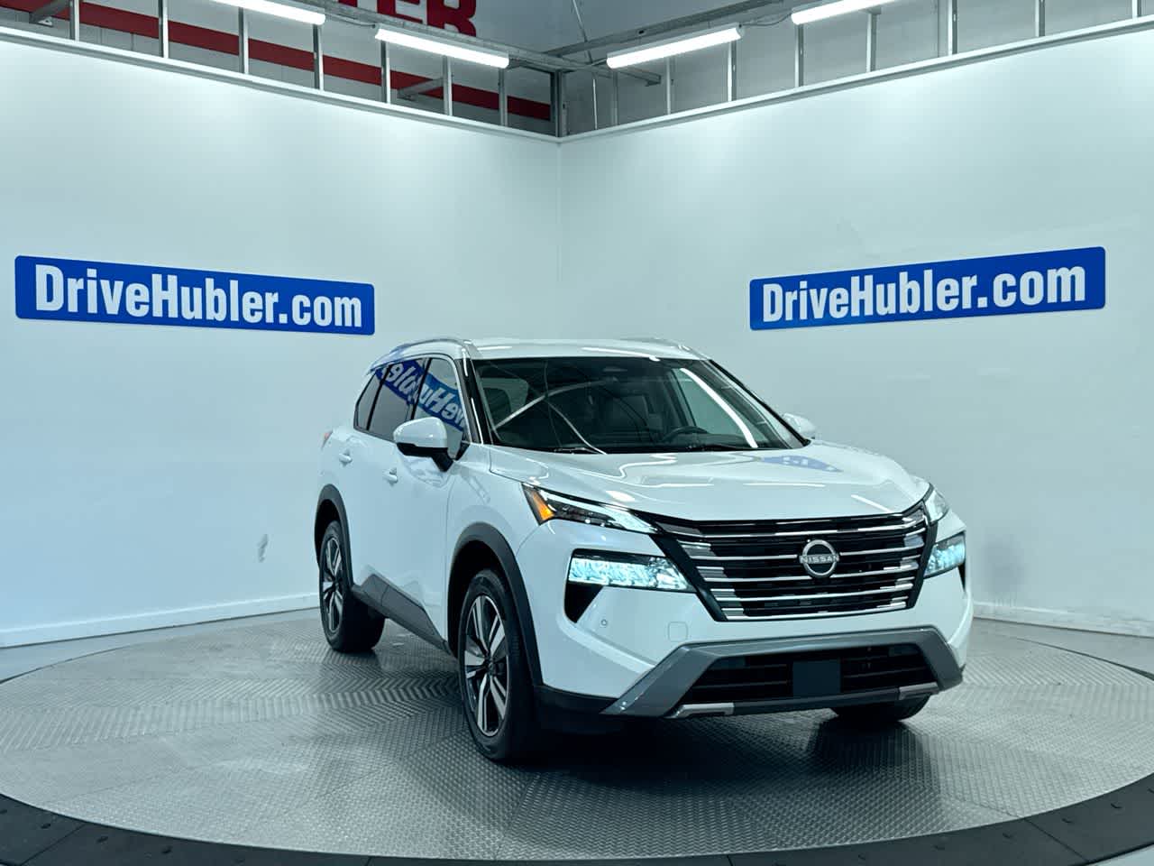 2024 Nissan Rogue SL in Everest White Pearl — front three-quarter view