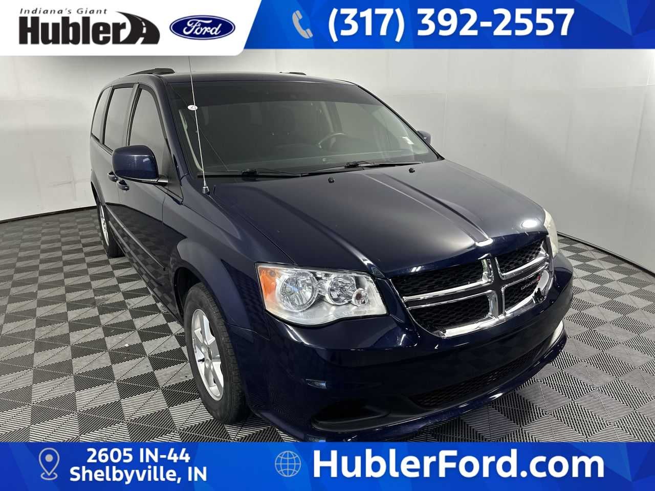 2012 Dodge Grand Caravan SXT in True Blue Pearl — front three-quarter view